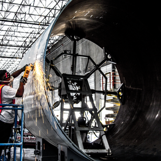 Grinding a fresh cut on one of our tubes at our Metalworks tooling shop in North Las Vegas.