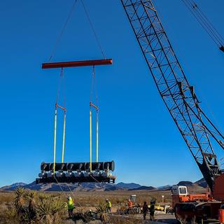 Moving our Leybold vacuum pump into position at DevLoop.